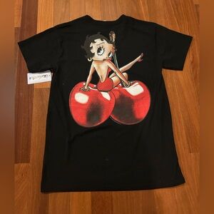 Black Brisco Graphic Tee featuring Betty Boop sitting on top of two red cherries